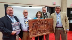 Sharing in this memorable occasion are David Sikes, Chairman of the River Region Friends of NRA; John Martin, Founder of SAT-C (Small Arms Training Consultants); Rebecca Wood, Founder of OWU; Rob Pinkston, OWU Board Member; and Chip McEwen, Boy Scouts of America Shotgun Shooting Sports Director.